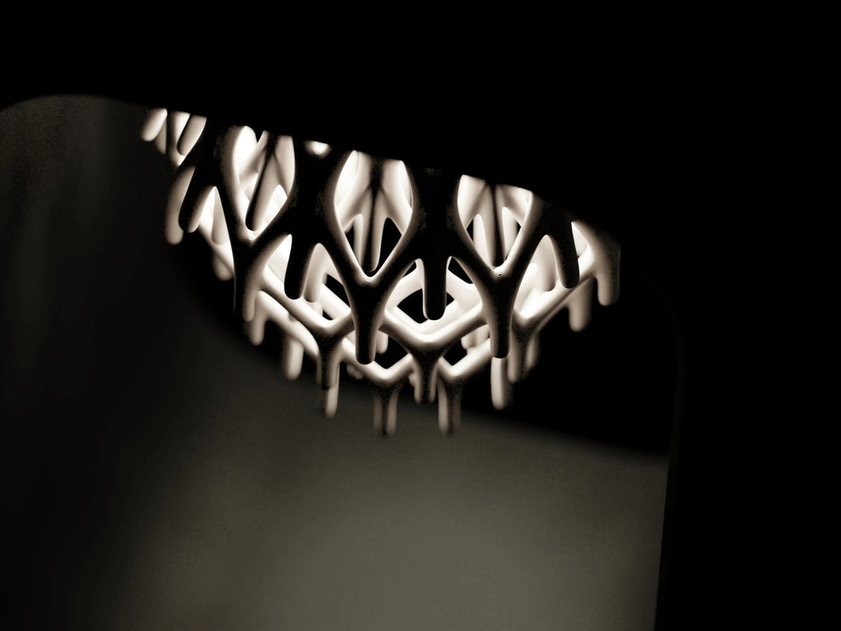 Tessar – Grown from light. Framed by shadow.